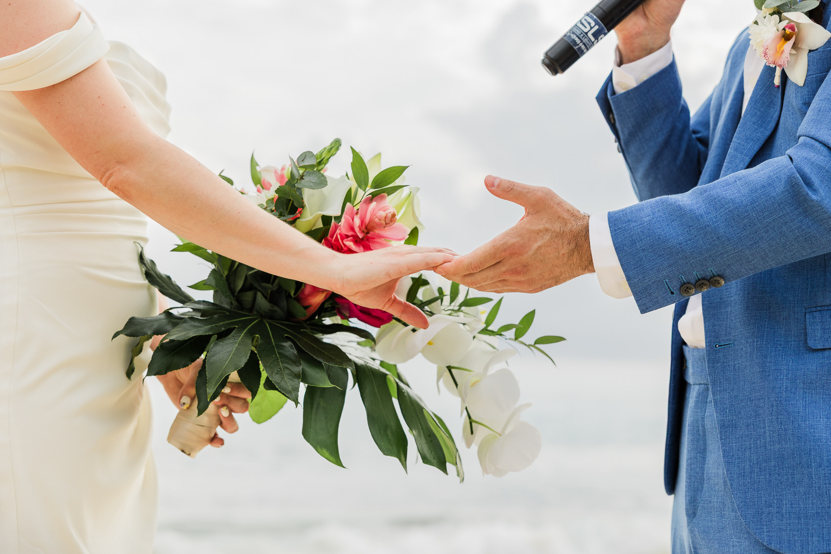 Bride and groom holding hands during their beach ceremony in Saint Martin